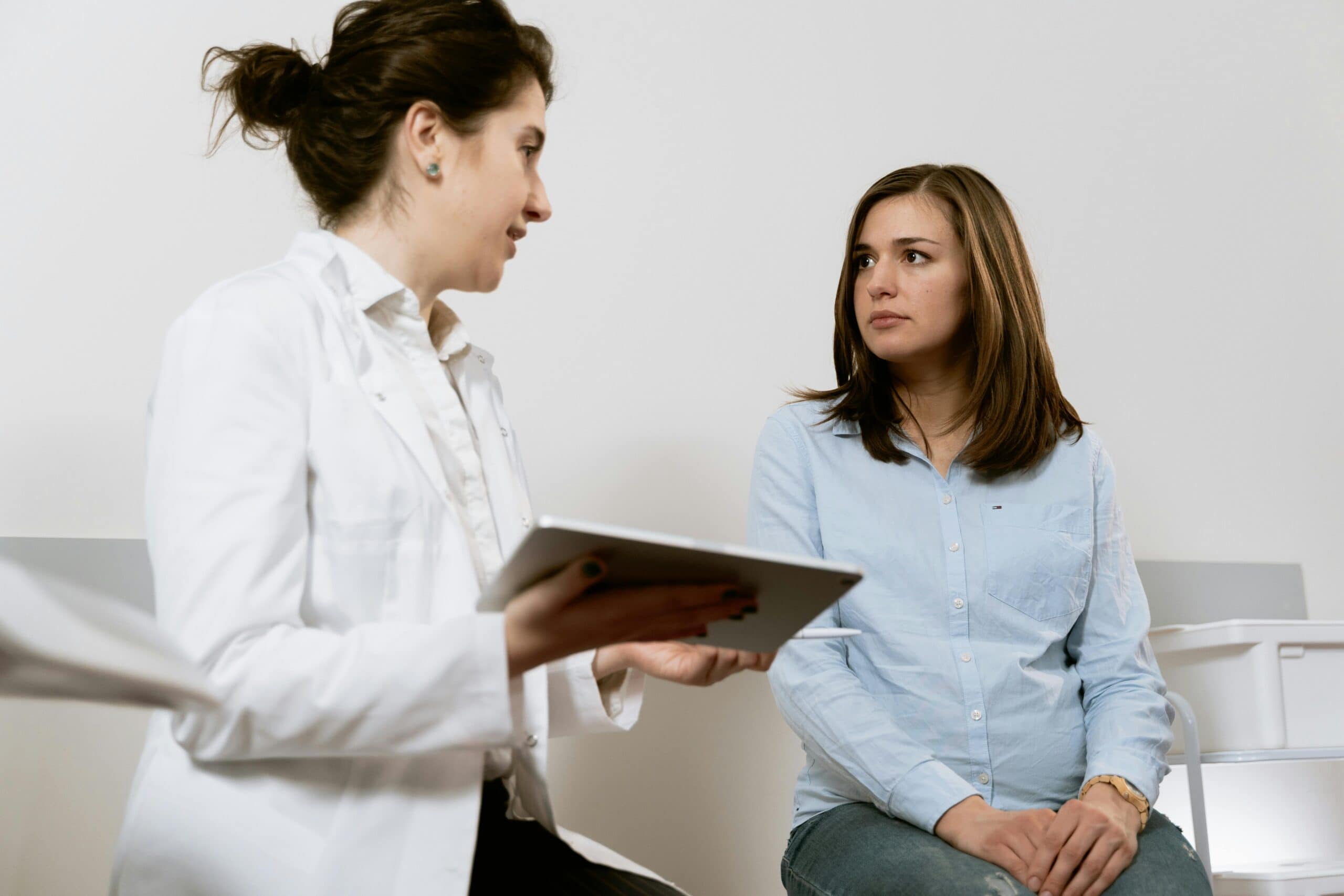 doctor talking to pregnant woman